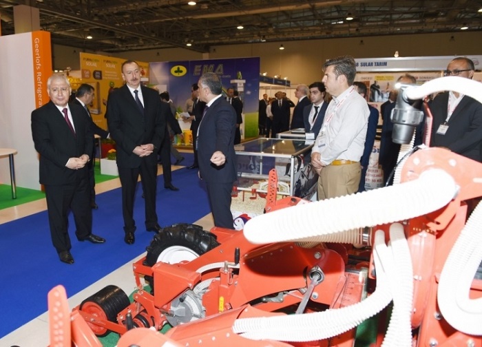 President Ilham Aliyev attends international exhibitions in Baku